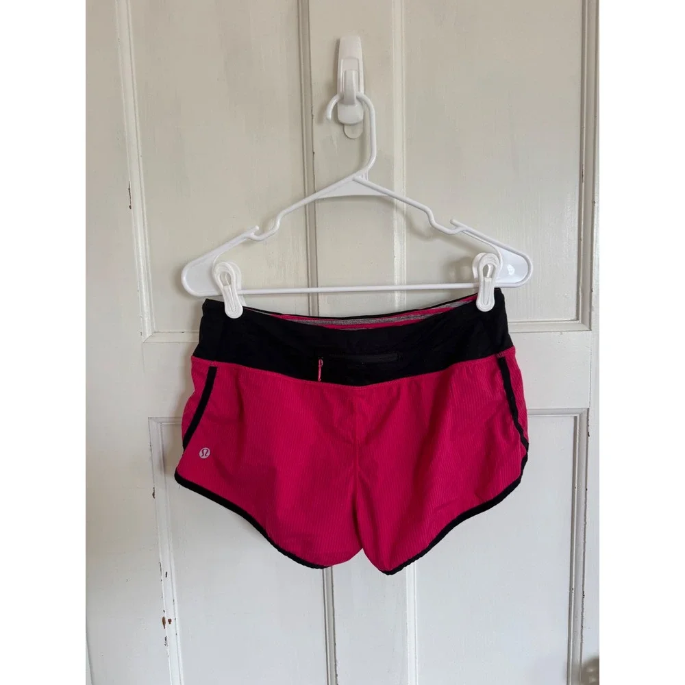 Lululemon pink & black shorts size 4.